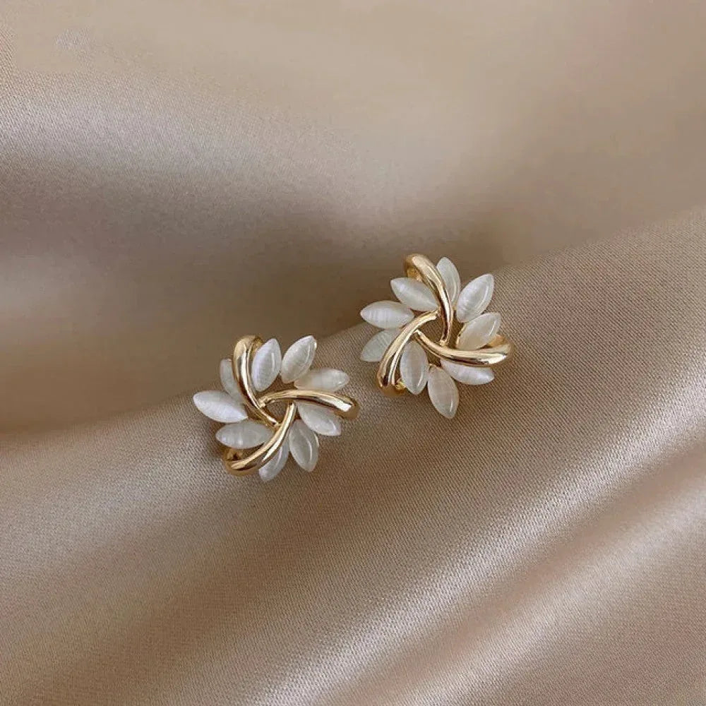 Elegant Gold Earrings with Exquisite Opal Flower Motifs - Sarah and Emma Portland