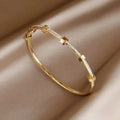 Elegant Golden Bracelet in Light Design - Sarah and Emma Portland