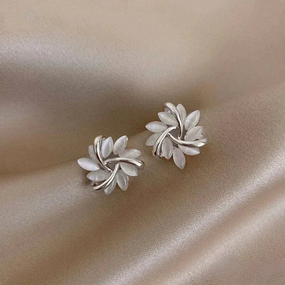 Elegant Gold Earrings with Exquisite Opal Flower Motifs - Sarah and Emma Portland